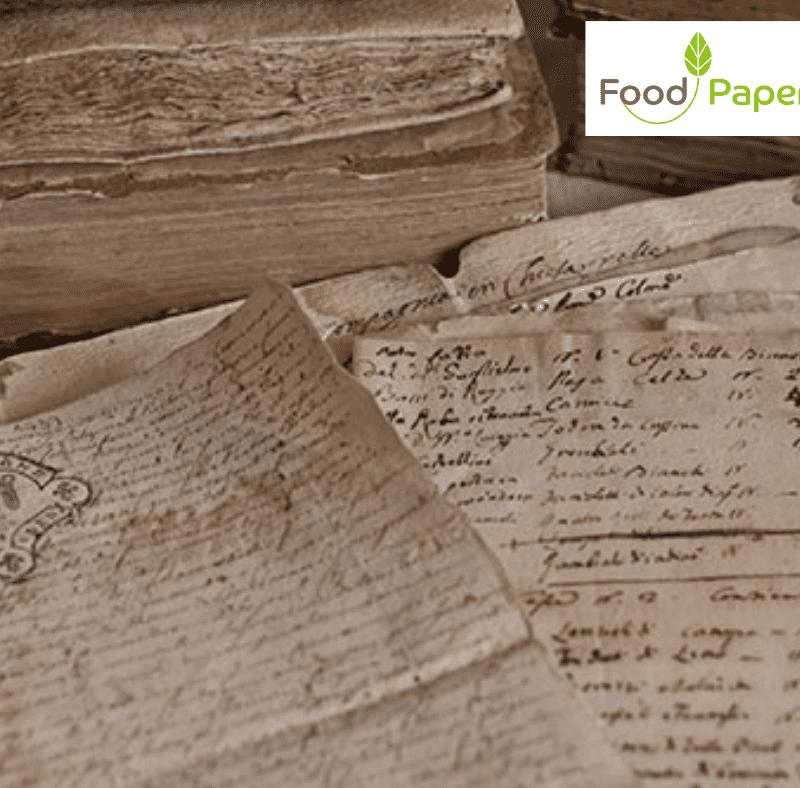 Close-up of vintage handwritten manuscripts and aged paper sheets, with Food Paper logo watermark for branding and heritage context.